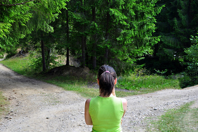 Girl with a choice near the forked road